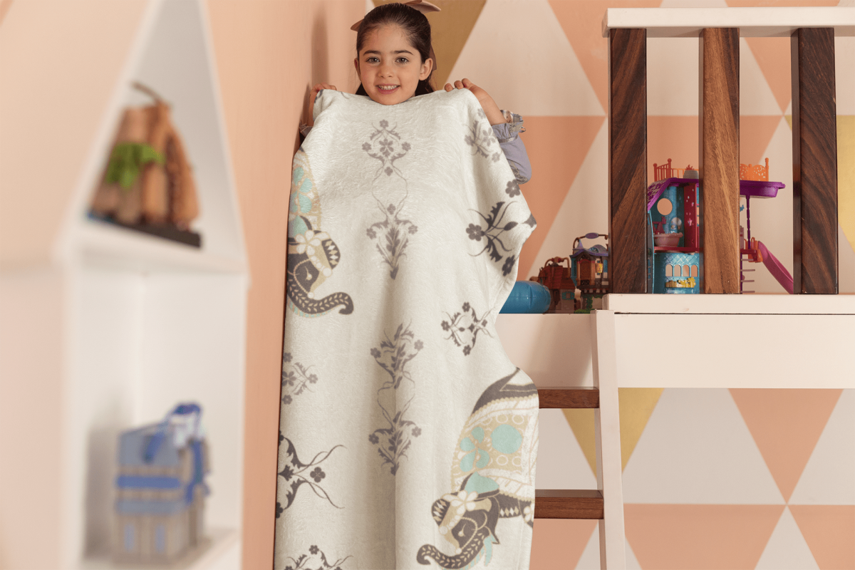 blanket mockup featuring a playful girl in her room 24691 1