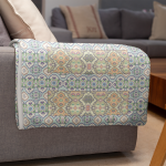 mockup of a throw blanket in a living room setting 24697 14