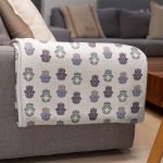 mockup of a throw blanket in a living room setting 24697 26