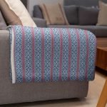 mockup of a throw blanket in a living room setting 24697 27