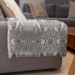 mockup of a throw blanket in a living room setting 24697 30