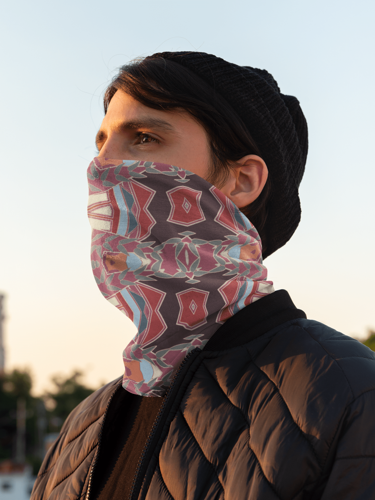 neck gaiter mockup of a man watching the sunrise 36086
